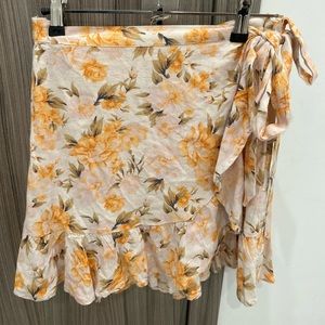Orange, yellow, and white floral wrap skirt
